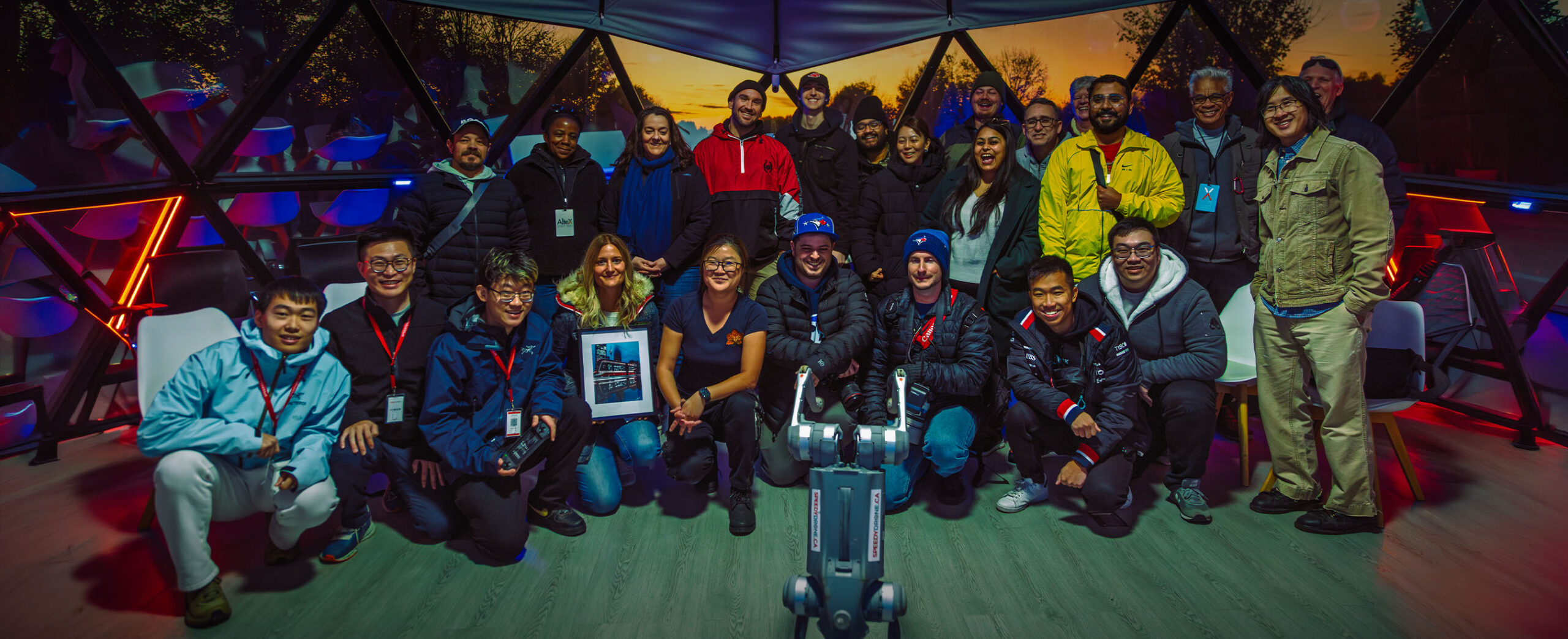 Group of people with drones and equipment in an AlteX community photograph